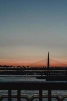 Bridge and city lights at dawn