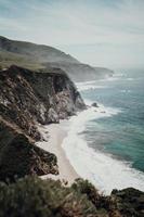 Mountain beside body of water  photo