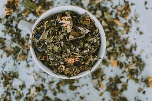 Mug full of dried herbs photo