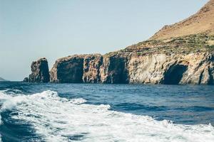 Ocean near a cliff photo