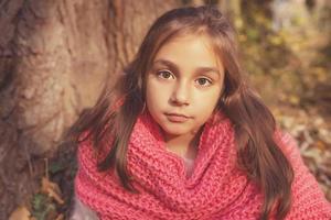 Adorable little girl outdoor in the forest