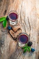 Homemade liquor with alcohol and berry fruits