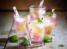 Pink cocktail with lime and mint