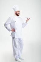 Happy male chef cook standing with plate