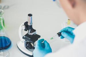 Back view of scientist working in laboratory photo