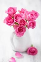 beautiful pink roses bouquet in vase photo