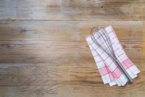 Kitchen towel background with whisk photo