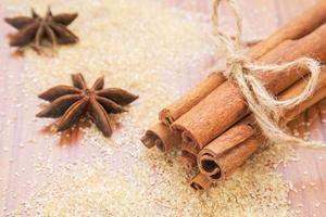 Star anise and cinnamon sticks on brown sugar