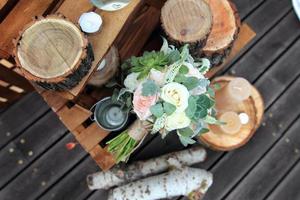 Bridal bouquet of roses on a wooden planks