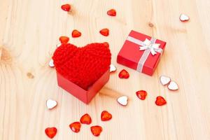 box with a cute red knitted valentine's heart photo