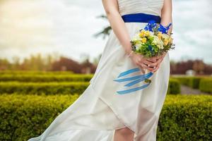 bridal bouquet of flowers in hands of the bride