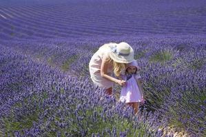 Mother with daughter in lavender field photo