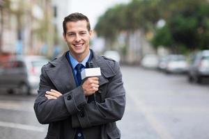 confident news reporter outdoors in the rain photo