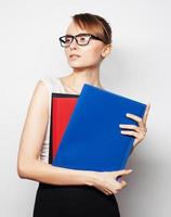 young businesswoman holding folders photo