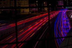 Time lapse of car lights on road photo