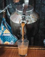 A man pouring tea photo