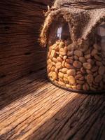 Coffee beans in jars in the sun photo