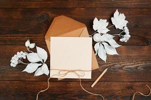 Top view of envelope and blank kraft greeting card  photo