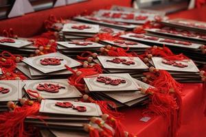 Red and white luck charms on red table photo