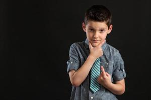 Young Confident Boy with Hand On Chin photo