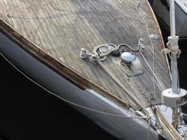 Prow of sailboat moored in the harbor