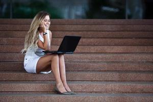 Young attractive businesswoman with a notebook photo