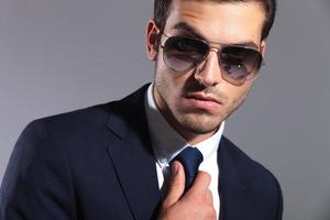 elegant business man wearing sunglasses