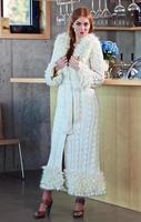 young beautiful woman in knitted coat photo