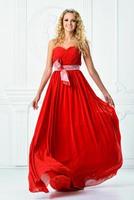 beautiful woman in red long dress. photo