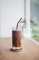 Ice coffee on wooden table photo