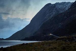 Mountain near body of water photo