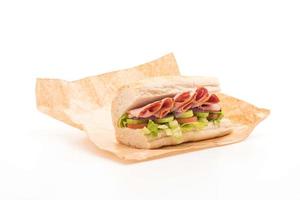 Ham submarine sandwich on cutting board photo
