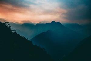 Sunset mountain with fog photo