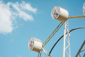 Two people on white ferris wheel photo