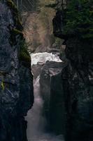 Crashing waves meet the rocky shoreline photo