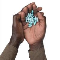 black hands with pills photo