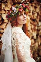 Beautiful red hair bride with flowers