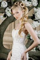 beauty young bride alone in luxury vintage interior with a photo