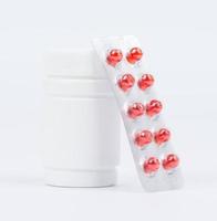 Bottles of medicines and pills in a blister pack photo