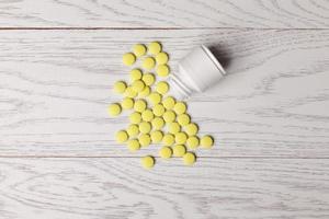 yellow pills with bottle