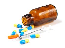 Insulin syringe and pills