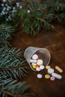 Tablets, pills, vitamins in winter composition. Christmas and Ne