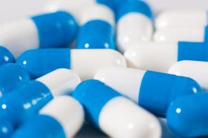 Background of blue and white capsule pills
