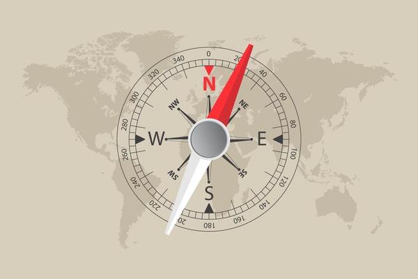 World map and magnetic compass 