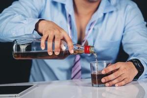 Man pouring whisky photo