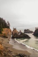 Rock formations near ocean during daytime photo