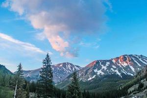 White snow capped mountains in horizon photo