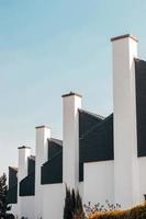 Stacks of building chimneys photo