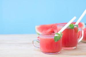 Watermelon drinks on wooden table photo