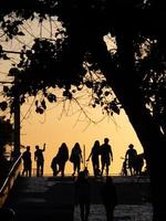 People walking at sunset photo